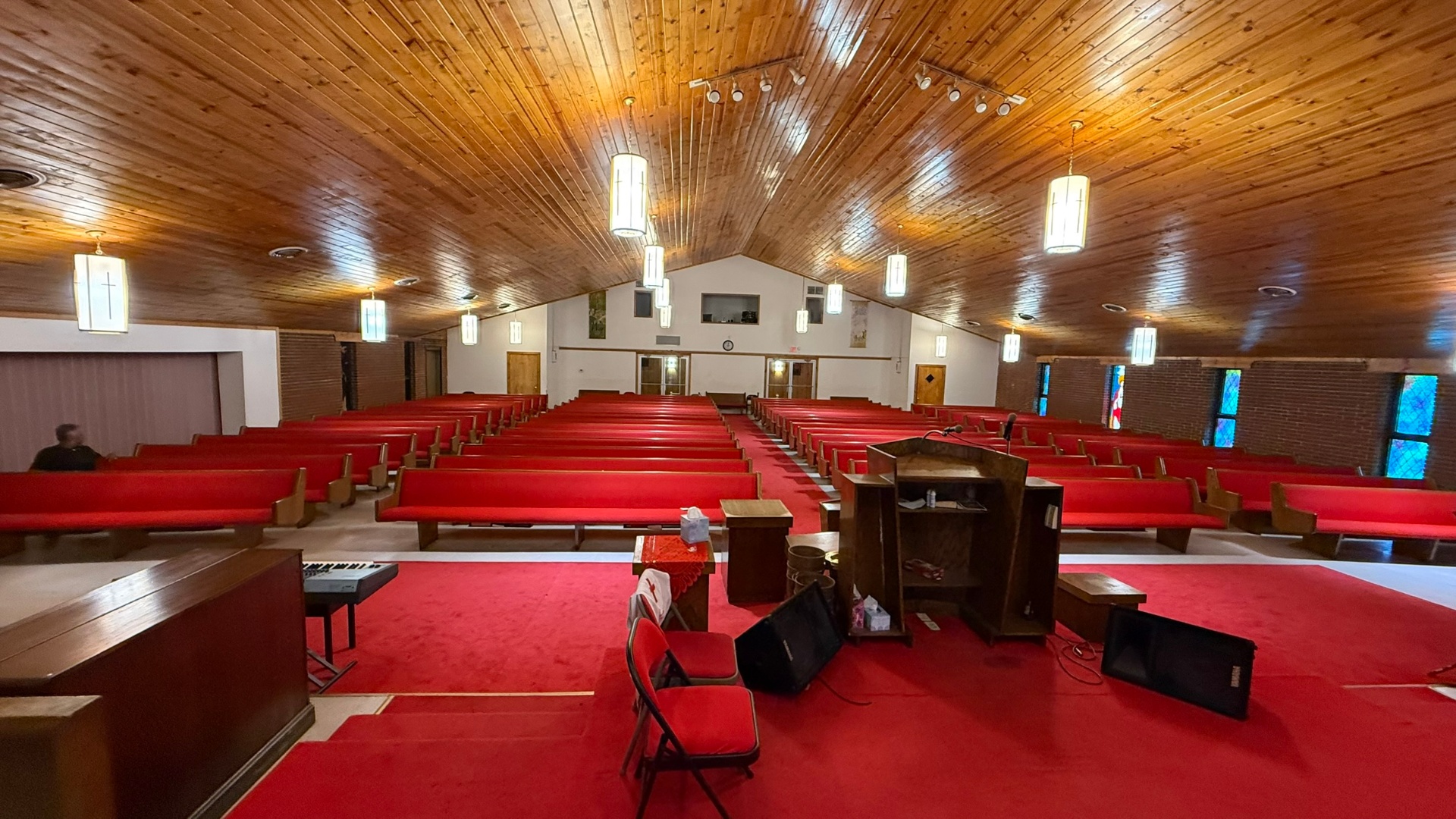 Freshly cleaned church sanctuary with polished pews